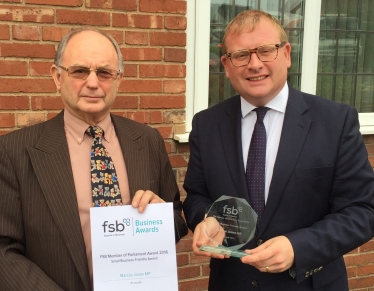 Marcus Jones accepting the award from the FSB